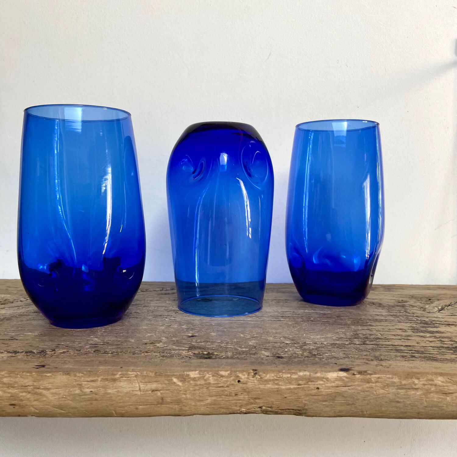 3 blue colored long drink glasses