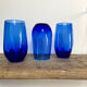 3 blue colored long drink glasses