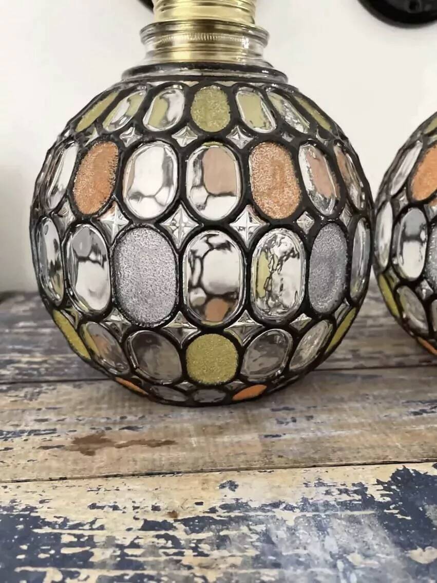Pair of faceted glass globe wall lights