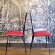 Pair of red Colette Guéden chairs