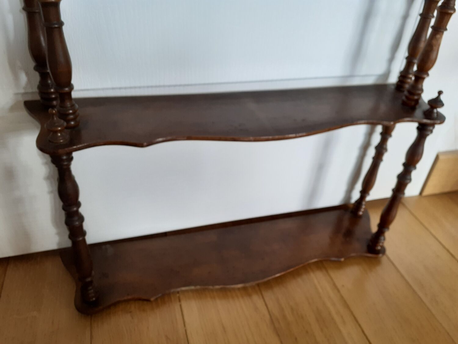 Turned wooden wall shelf