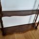 Turned wooden wall shelf