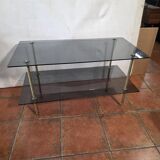 Smoked glass and brass coffee table from the 1970s.