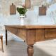 Vintage farmhouse table with turned legs.