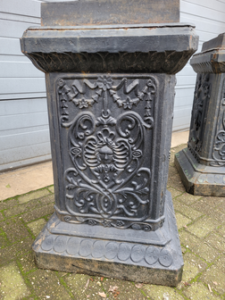 Large antique cast iron vases on pedestal