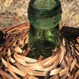 Glass cylinder with wicker casing
