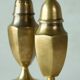 Pair of patinated brass salt and pepper shakers, 20th century.