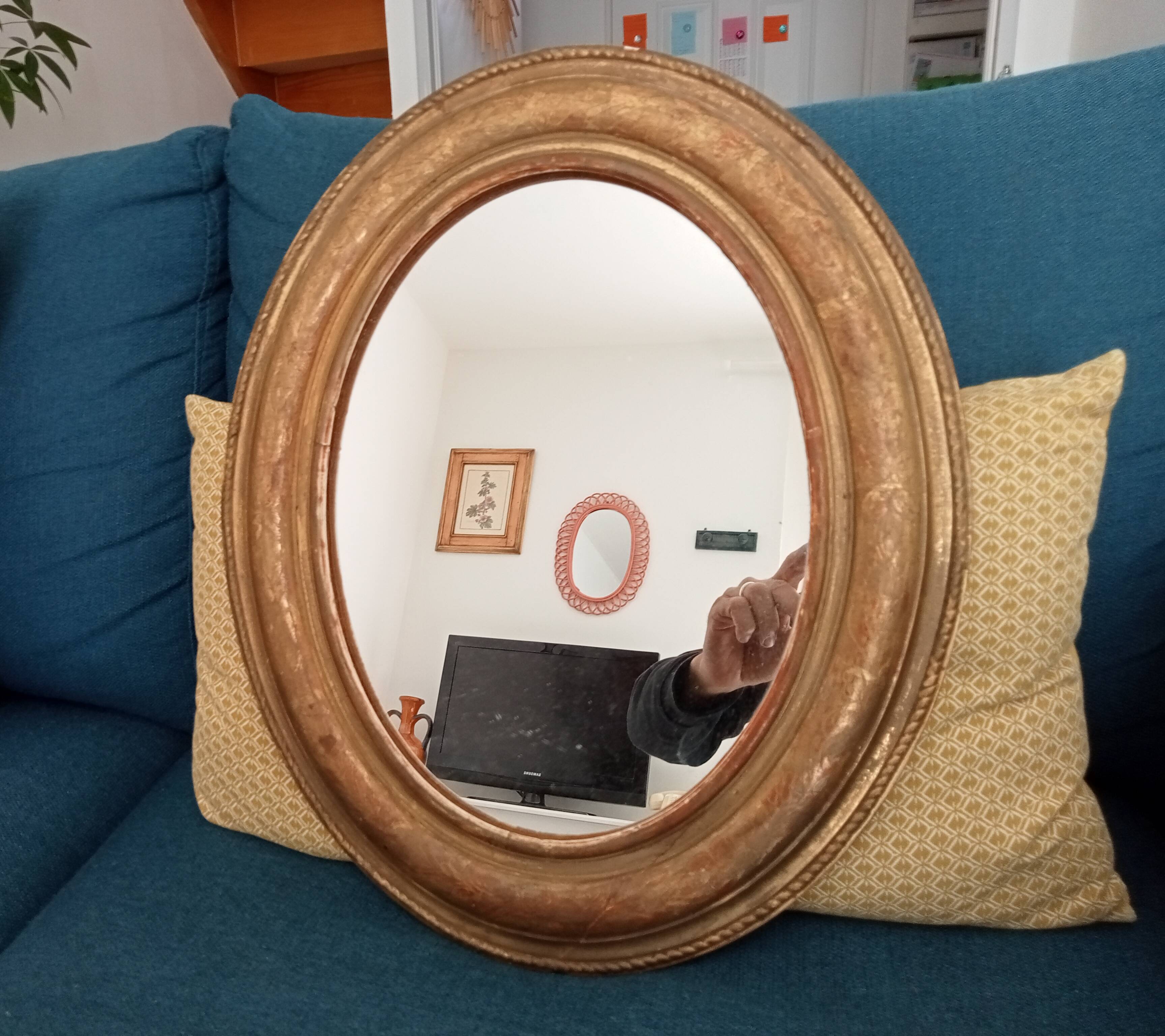 Louis Philippe 19th century oval gilded mirror in wood and stucco