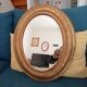 Louis Philippe 19th century oval gilded mirror in wood and stucco