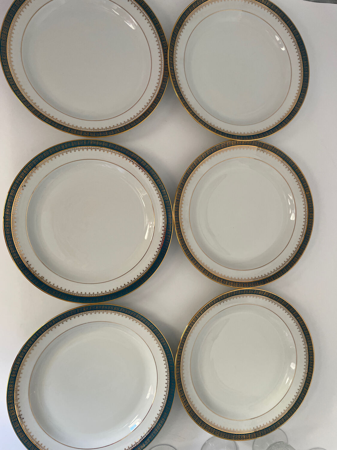 Six slightly hollow Limoges porcelain plates.