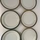 Six slightly hollow Limoges porcelain plates.