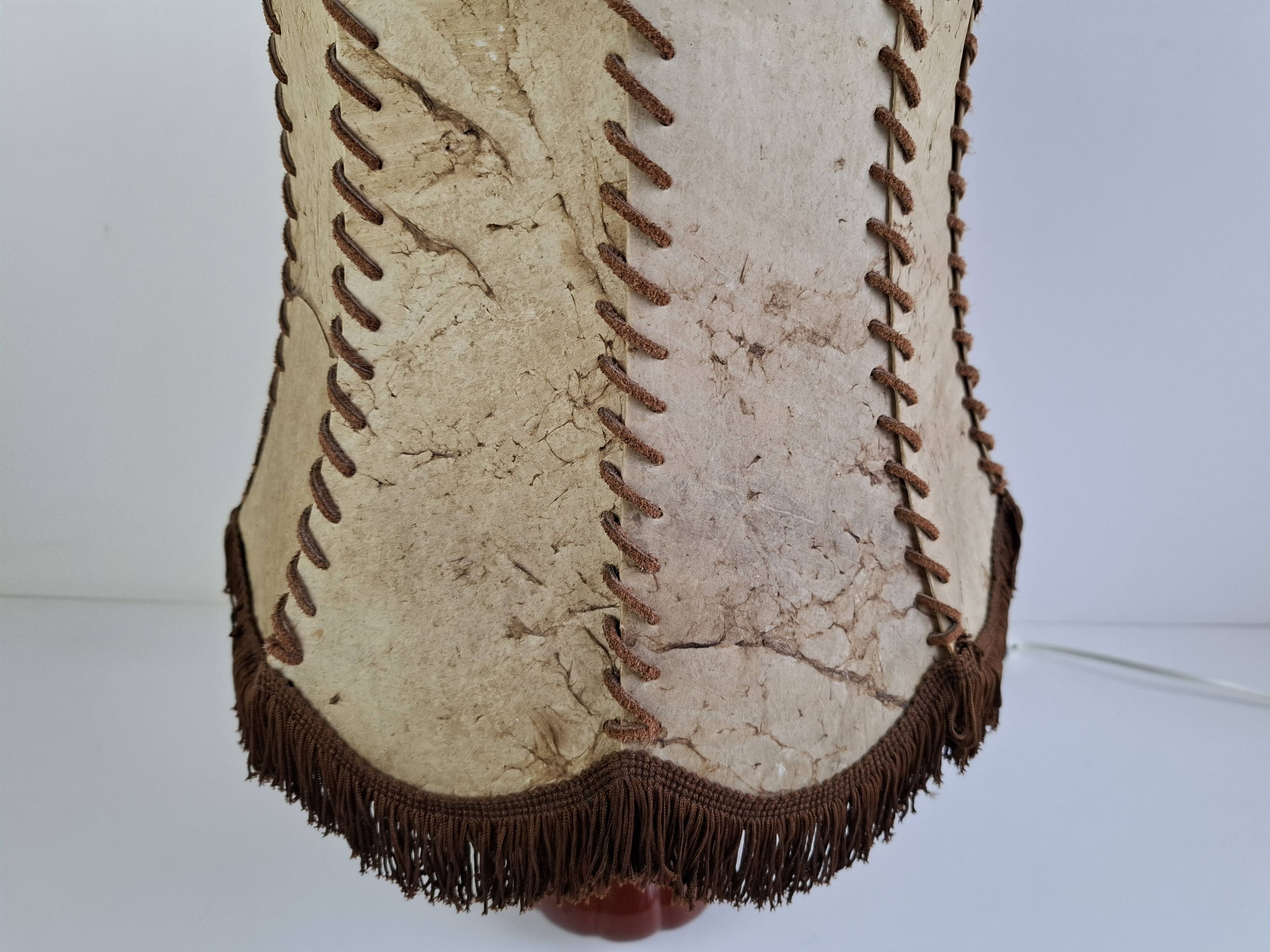 Vintage ceramic table lamp with hand-stitched leather shade, 1980s.