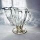 Glass pitcher on base