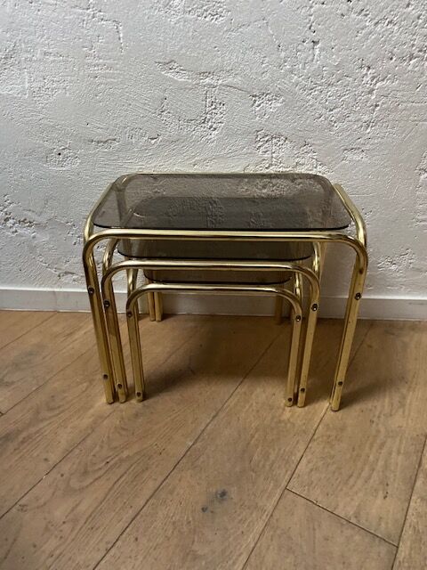 Series of 3 nesting tables in smoked glass & gilded brass