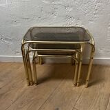 Series of 3 nesting tables in smoked glass & gilded brass