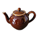 Vintage ceramic teapot (glazed earthenware) in brown colour.