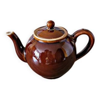 Vintage ceramic teapot (glazed earthenware) in brown colour.