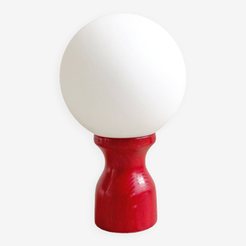 Vintage red wooden table lamp with a milk glass shade