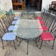 Glass and iron table with two side tables and 8 chairs