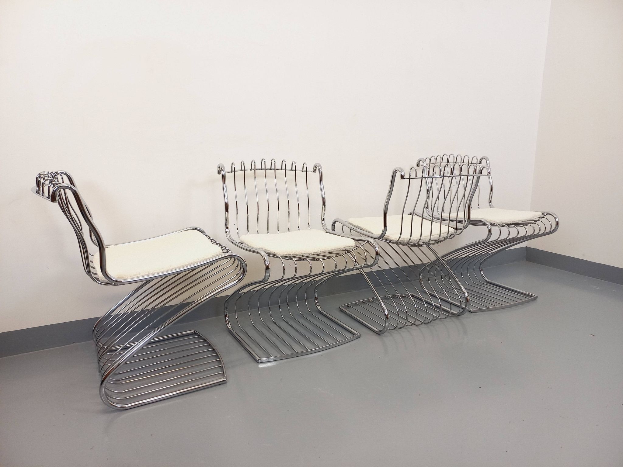 Set of 4 vintage Italian chairs by Gastone Rinaldi in chrome metal.