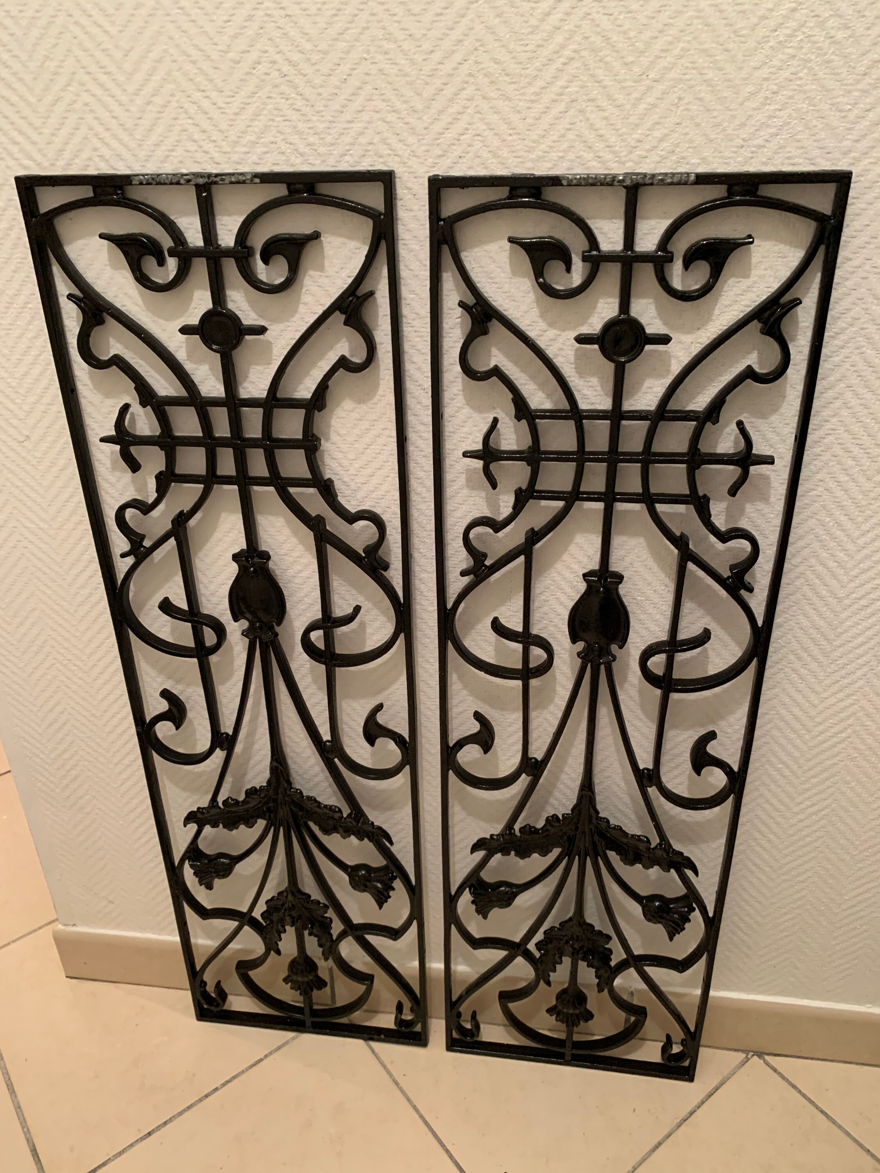 2 Art Nouveau ironwork grids decorated with inopuly or blueberry decoration