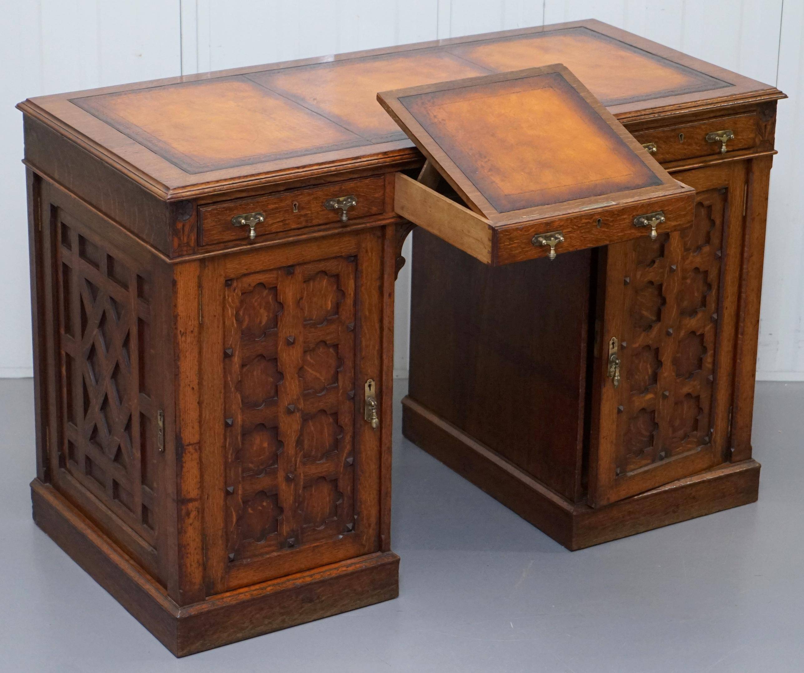 Restored Gothic desk with side bookshelves, drawer, and sloping top by Pugin Gillows.