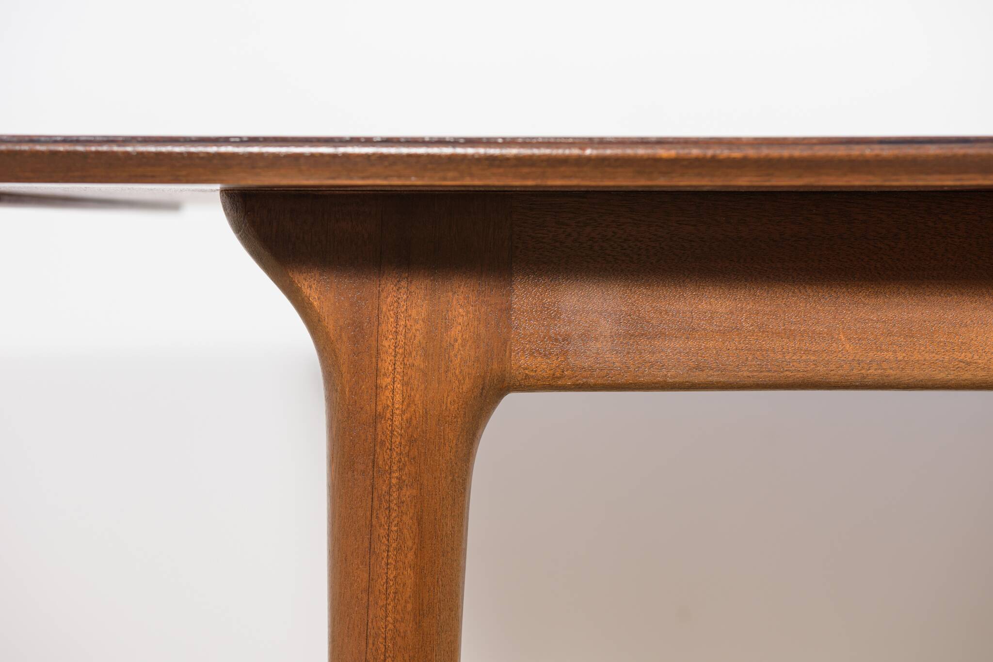 Extendable teak dining table in Mid-Century style from McIntosh, UK.
