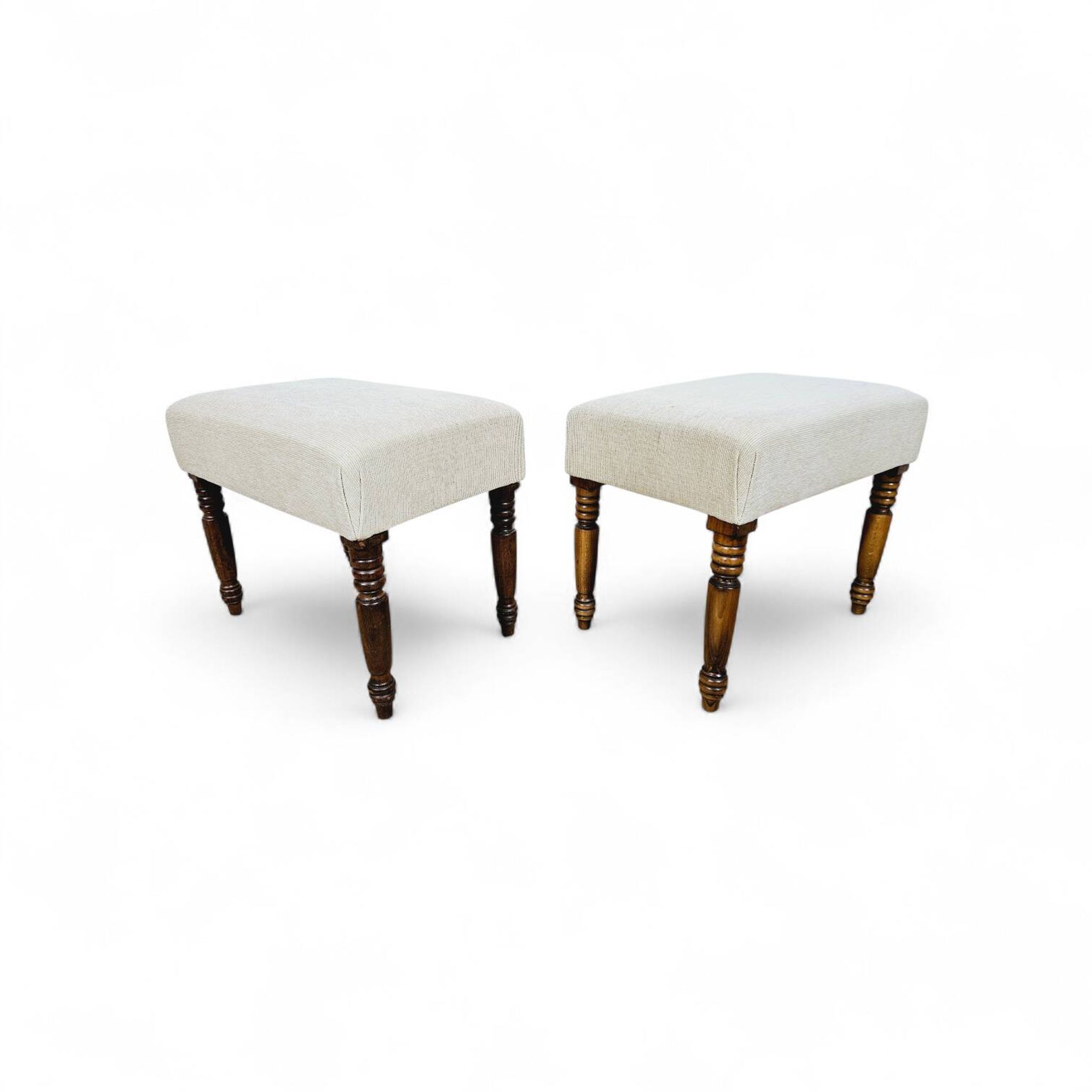 A pair of English upholstered pouffes/footstools from the 19th century