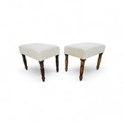 A pair of English upholstered pouffes/footstools from the 19th century