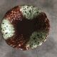 Ceramic fruit bowl centrepiece with grape cluster decoration, numbered.