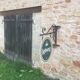 Double-sided "Loburg Beer" metal sign on wrought iron bracket