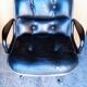 Fauteuil Charles Pollock cuir noir époque 1970