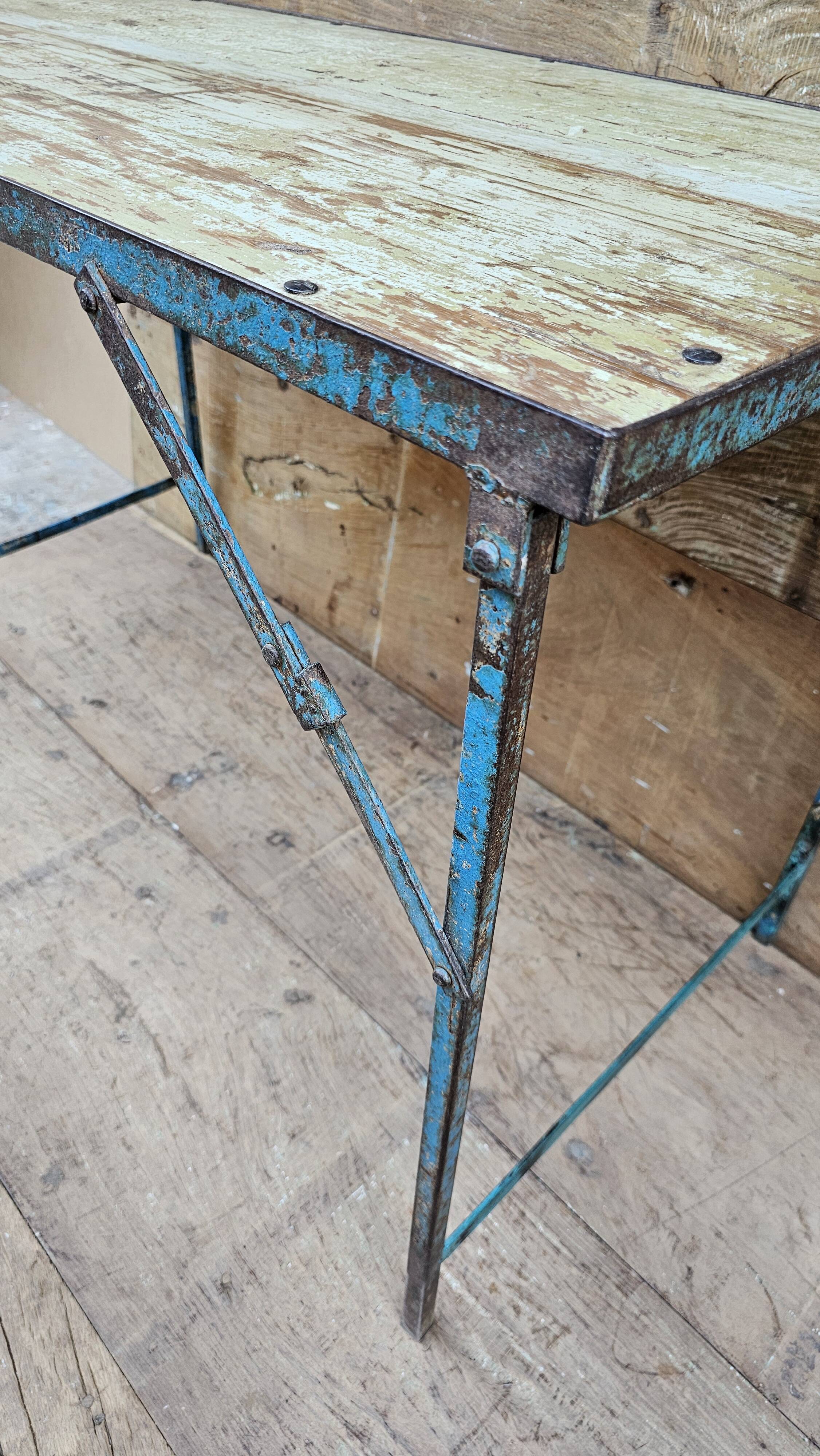 Old folding table in Burmese teak and steel