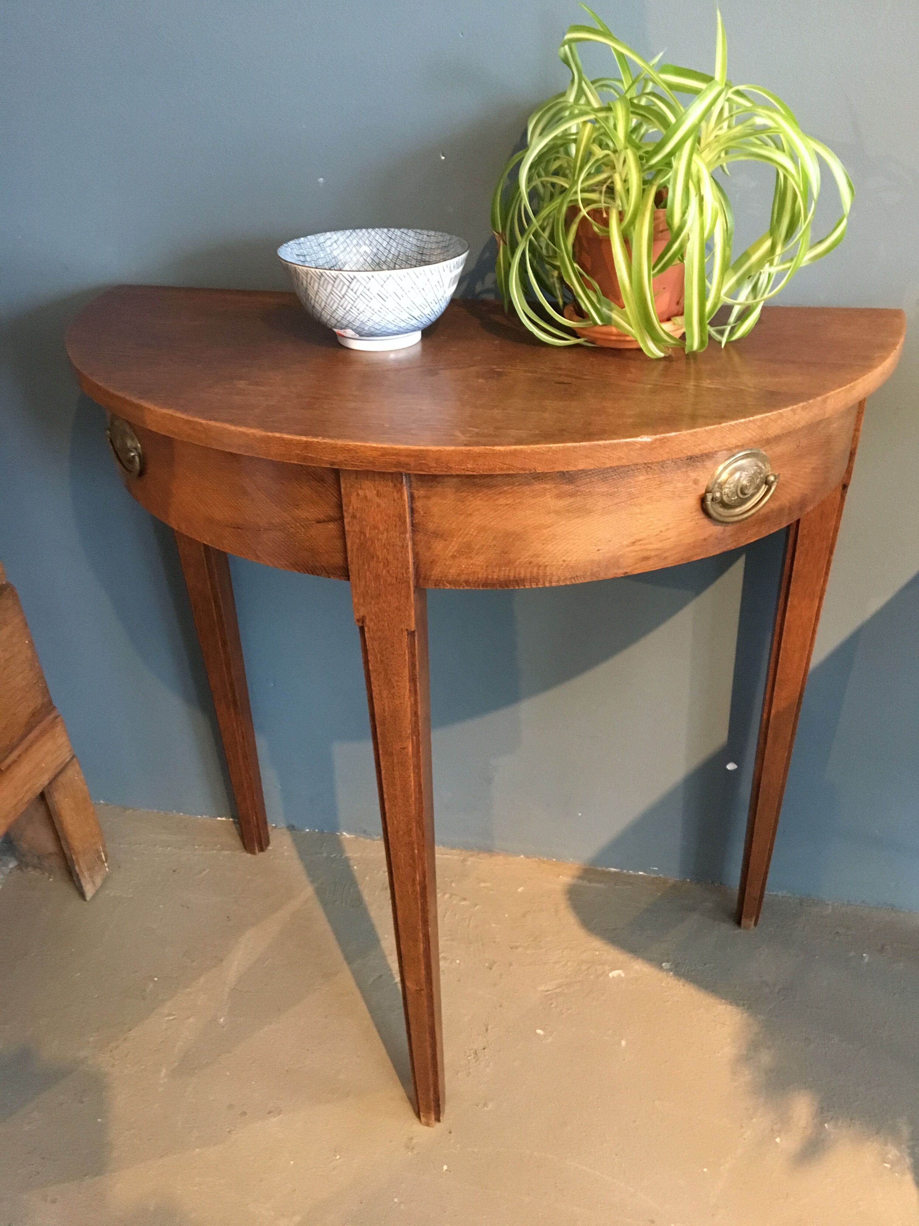 Old wooden half moon table