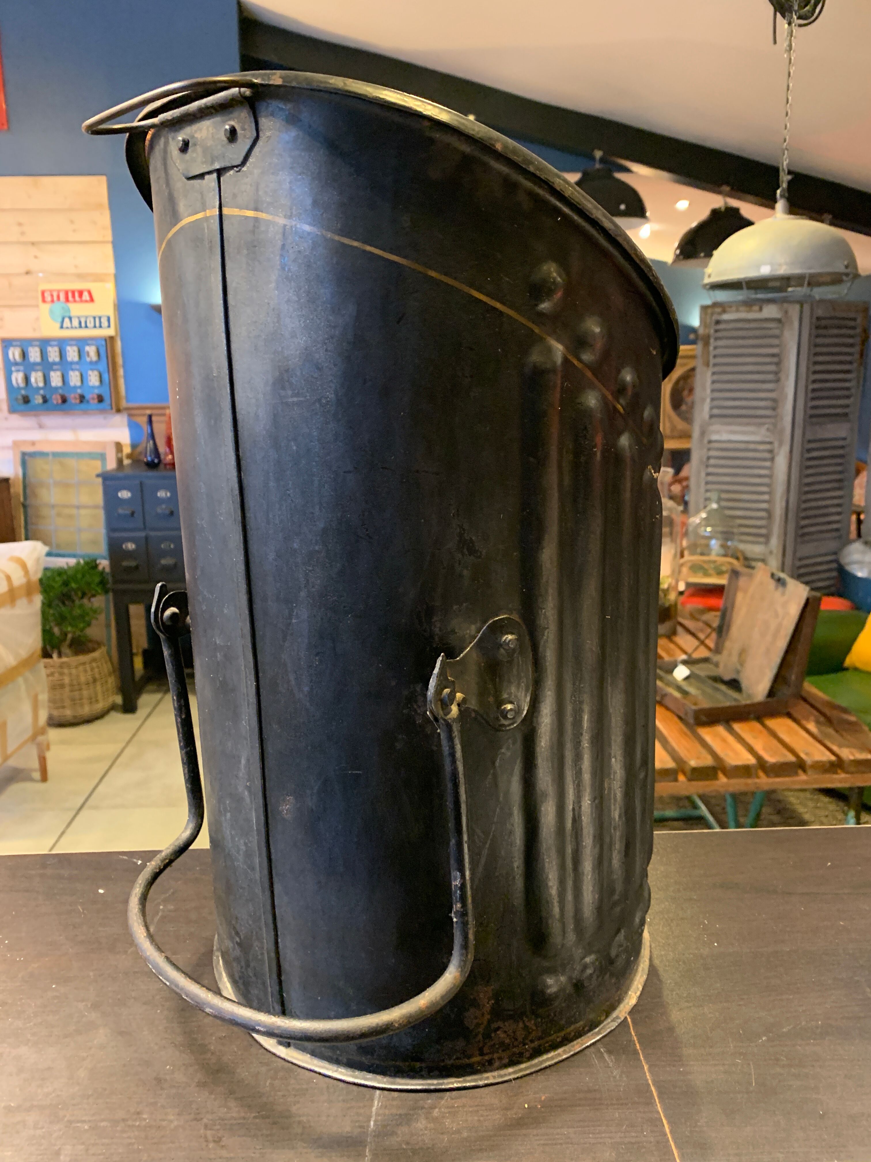 Coal tray decorated in black sheet metal