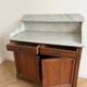 Antique wooden and marble washstand.