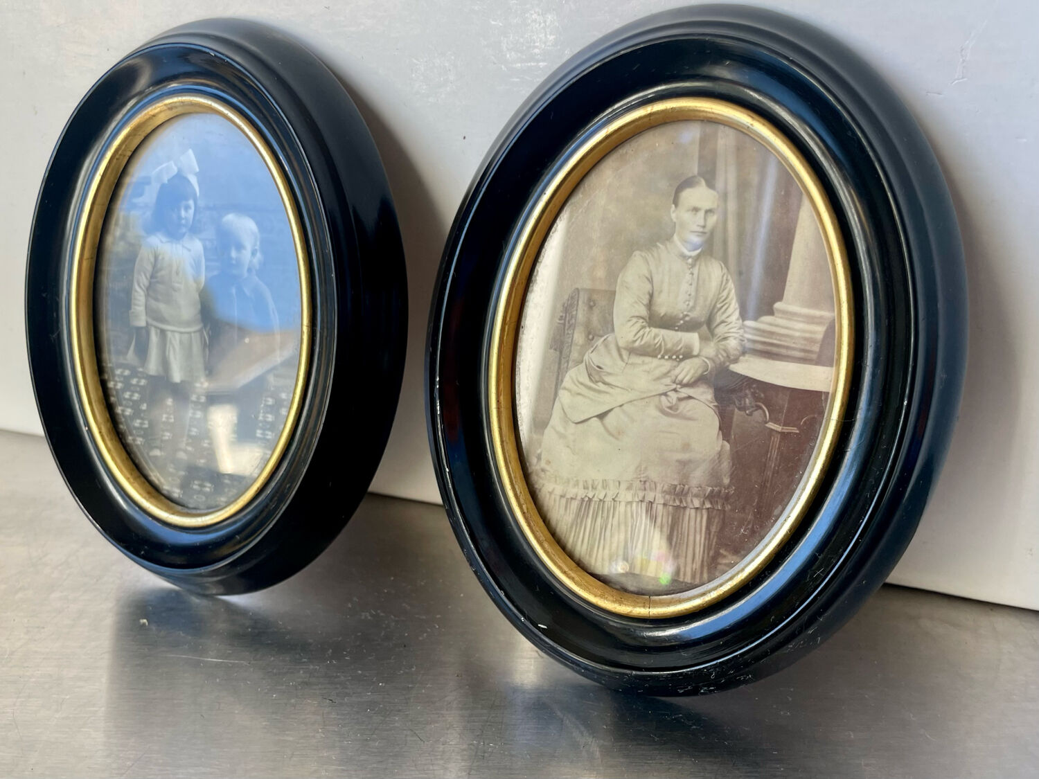 Pair of black wooden oval frames 1880’s  each 13 cm x 10 cm glass measurements 8.5 cm x 5.5 cm