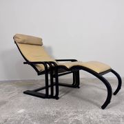 Rocking lounge chair, curved wood, leather, Viennese cane design.