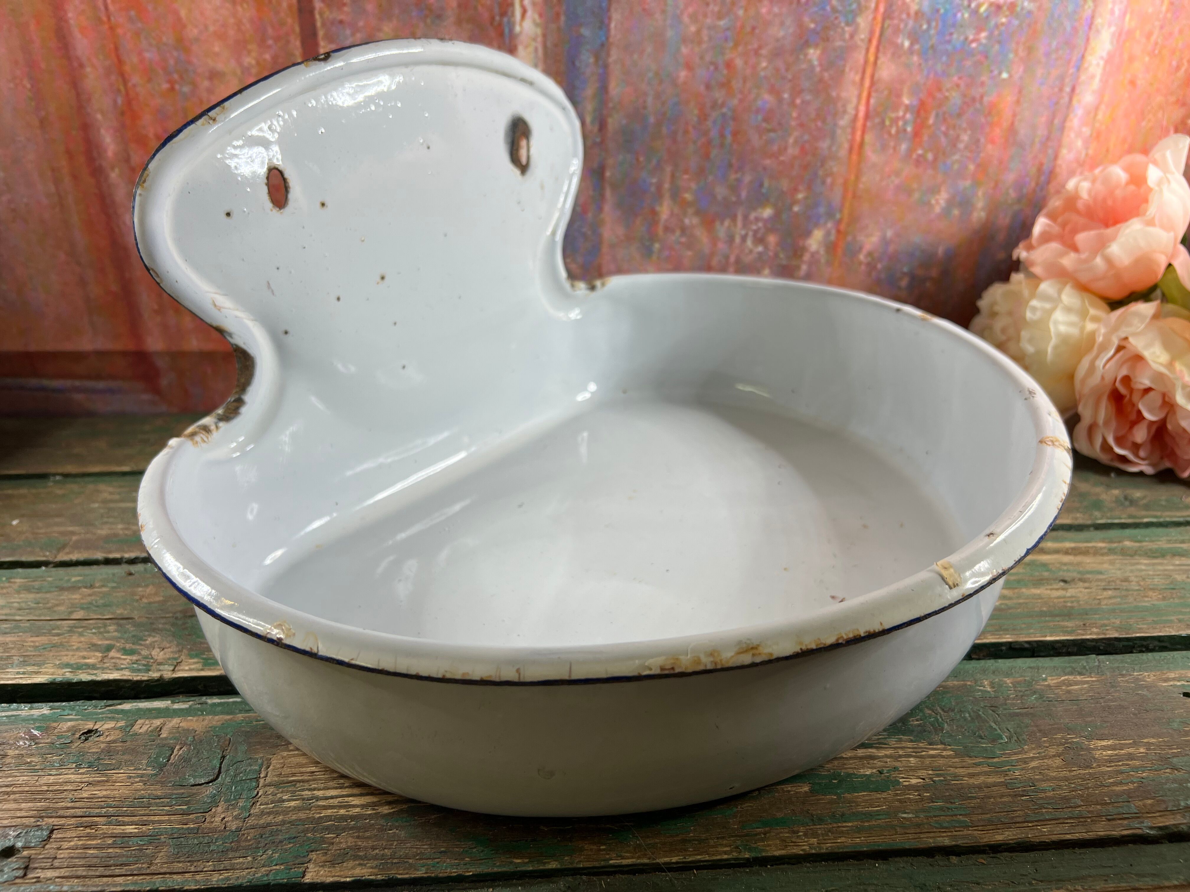 Old white enamelled hand washbasin or gardener enamel garden