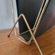 Vintage metal magazine rack in gold and black vinyl Newspaper holder