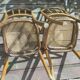 Set of 2 antique bistro chairs. Curved and turned wood.