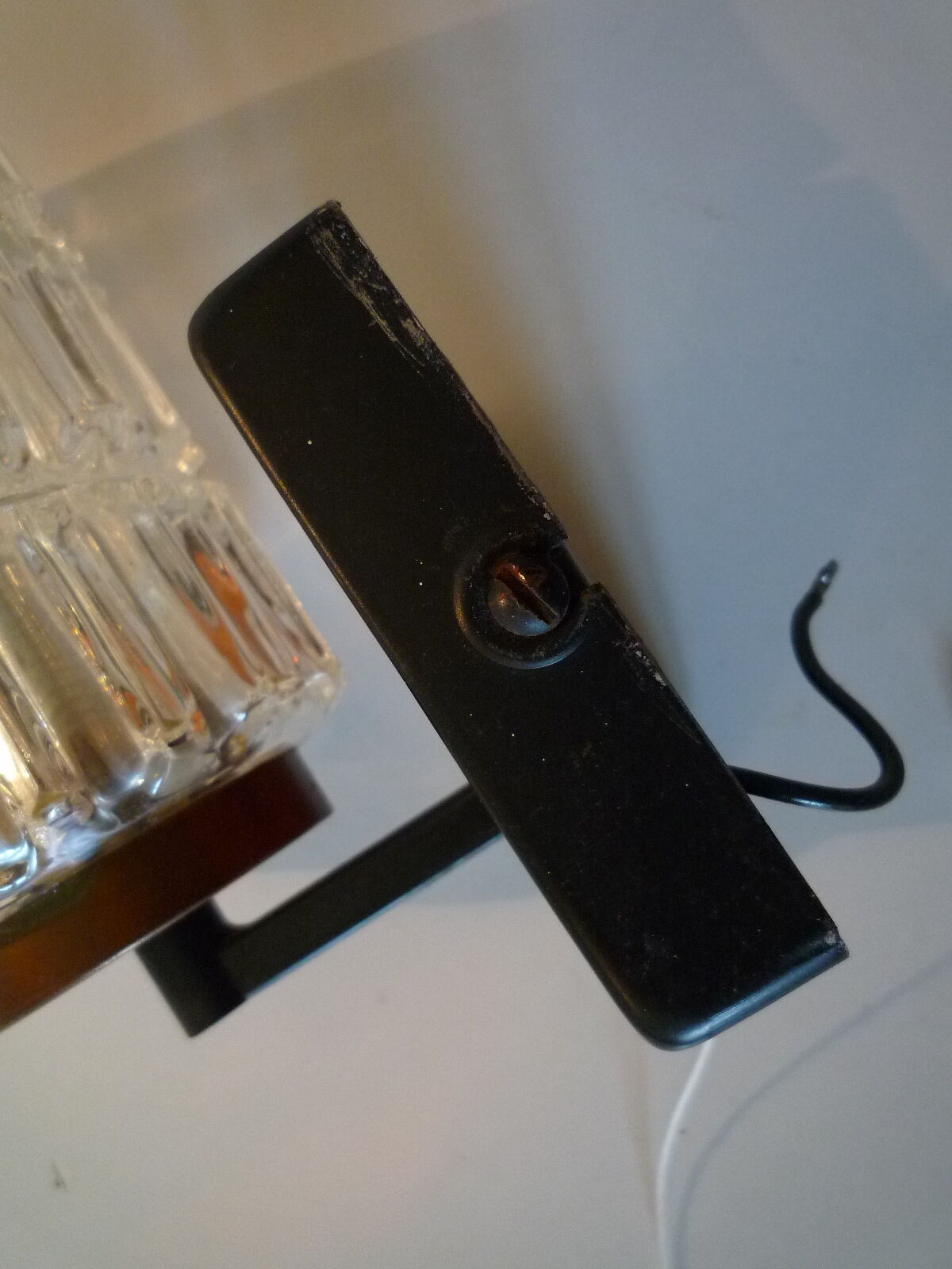 Pair of black lacquered metal, brass and glass wall light