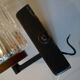 Pair of black lacquered metal, brass and glass wall light