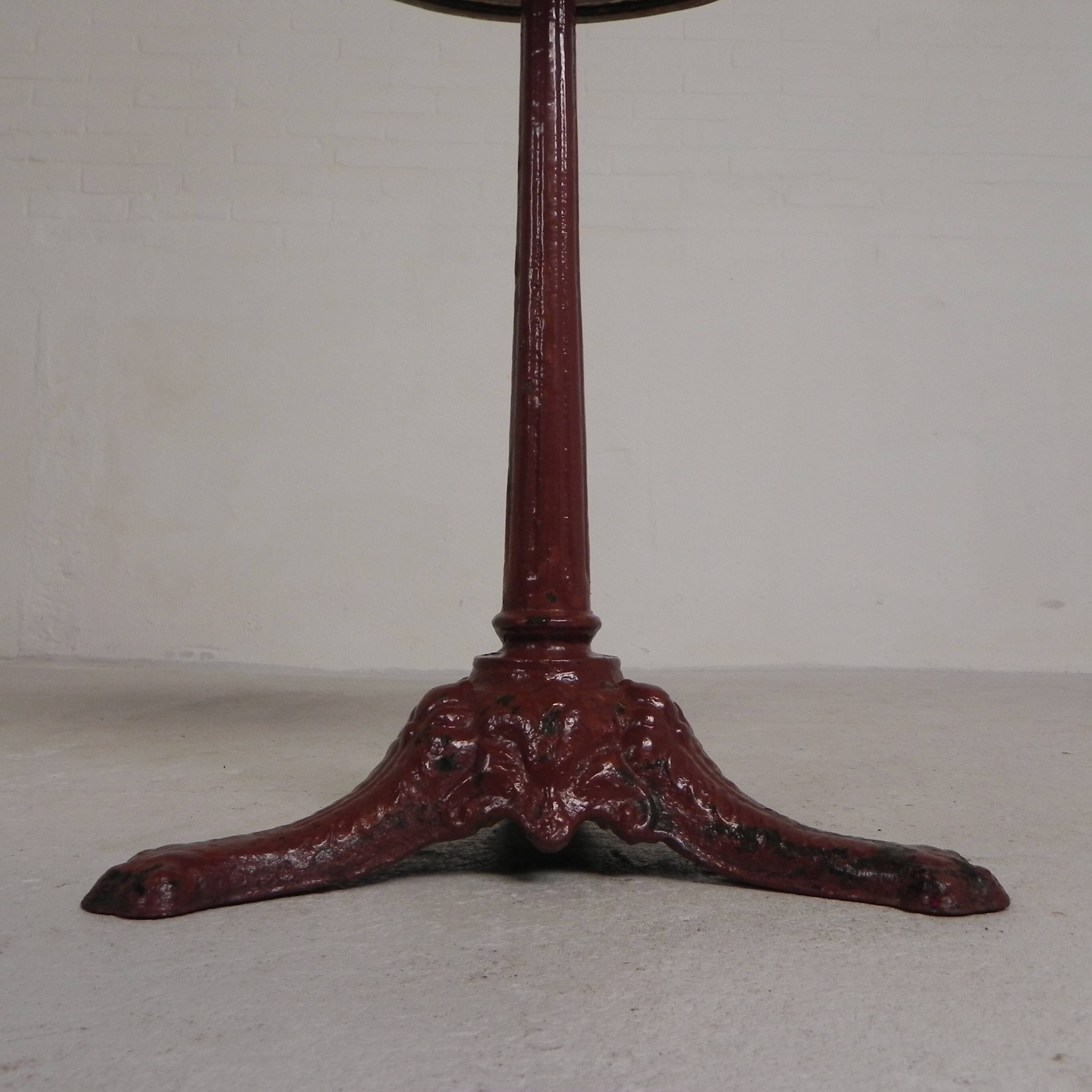 Bistro table with cast iron legs and marble top, 1920s.