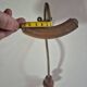 Vintage 1960s wall coat rack in wood and metal.
