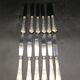 12 silver metal table knives model Rocaille