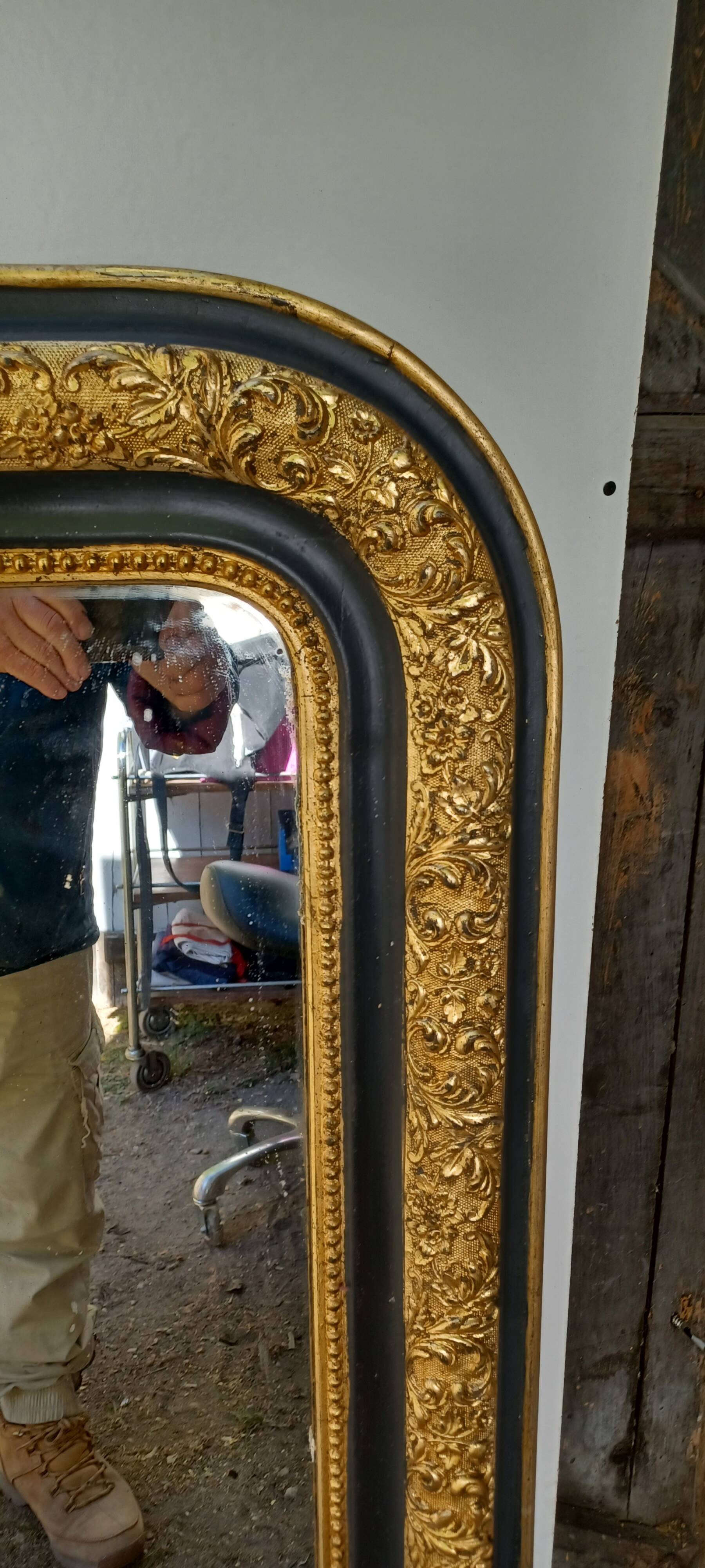 Louis-Philippe mirror, gilded and grey patina, circa 1890.