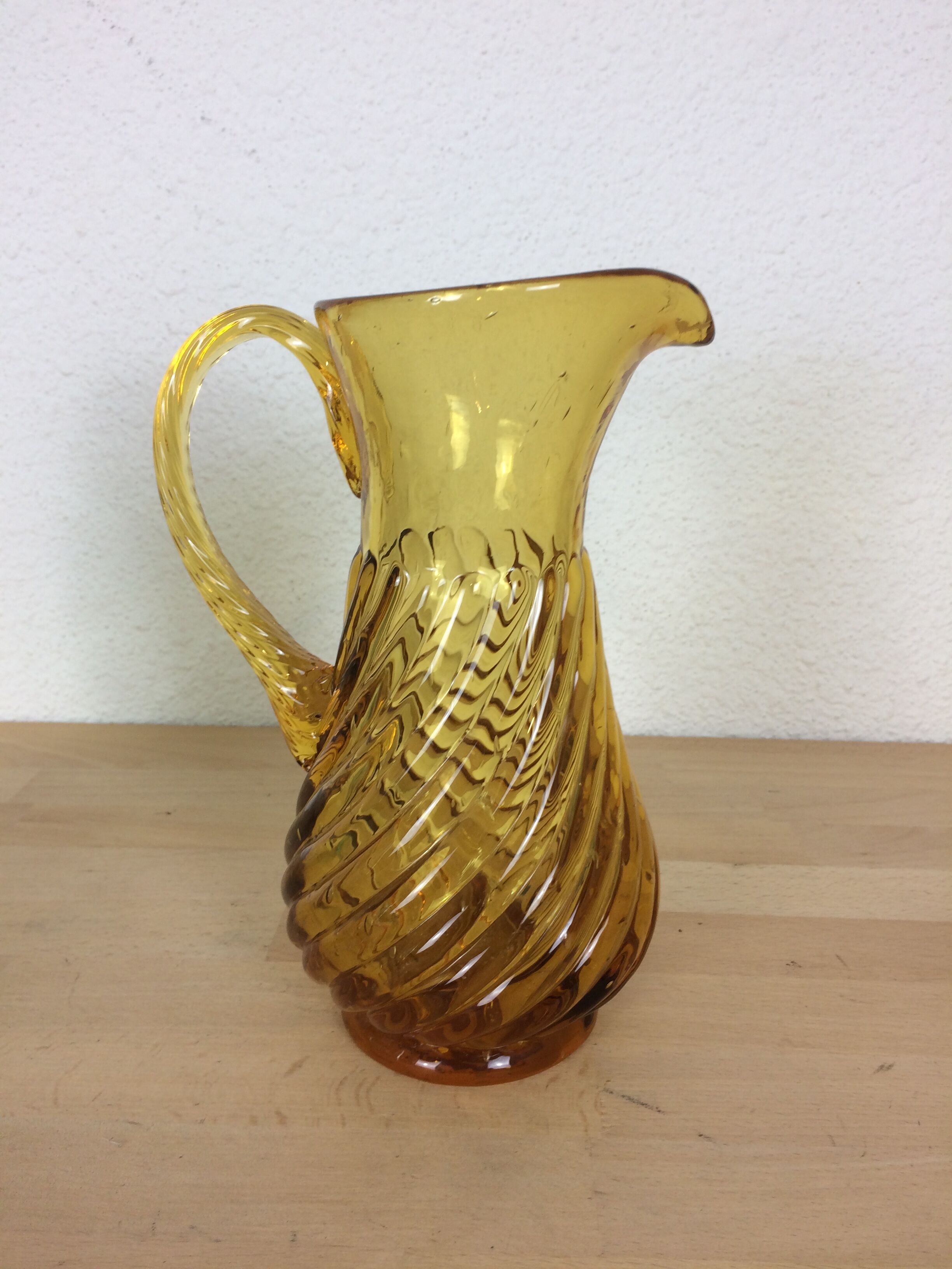 Twisted amber glass pitcher