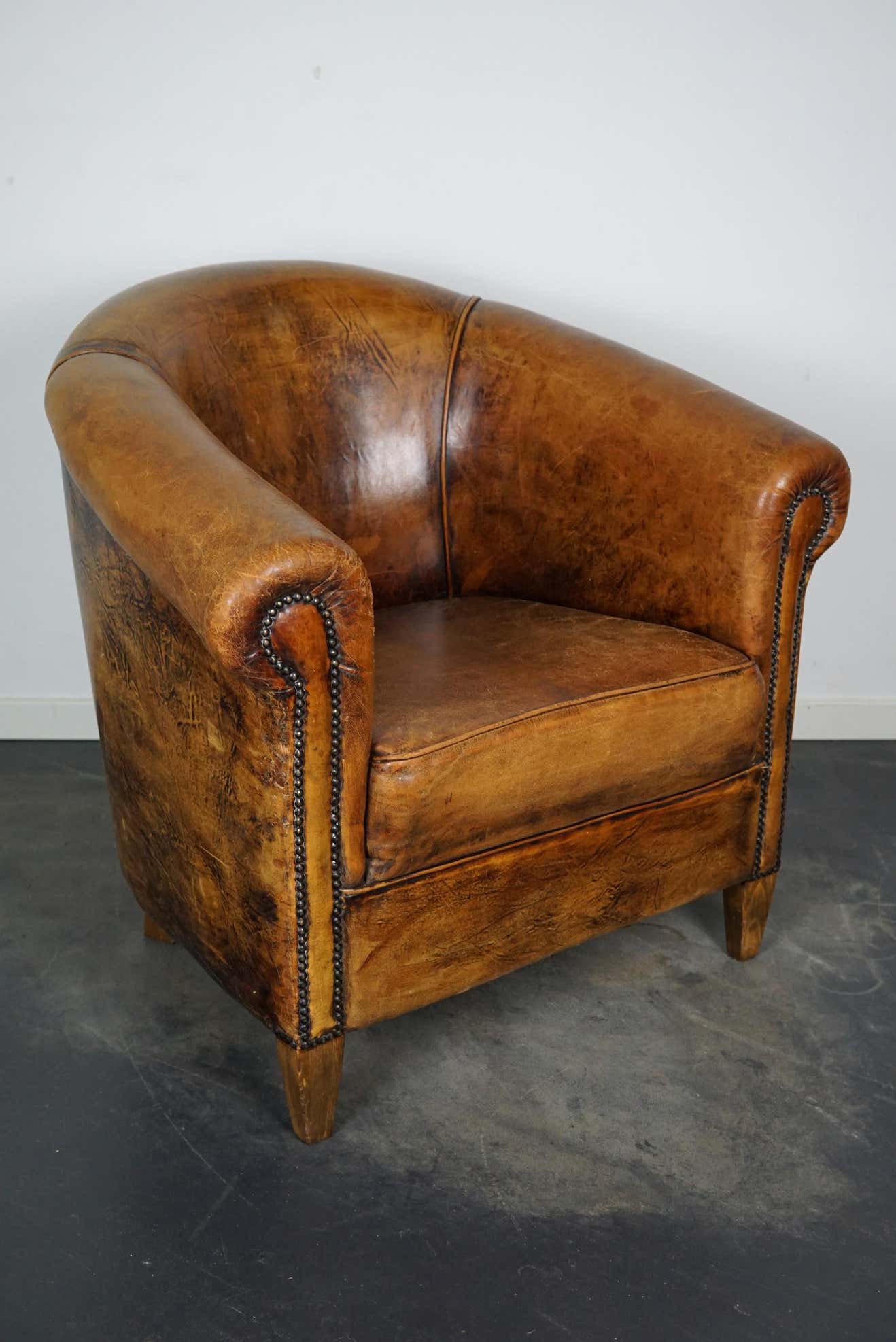Vintage club armchair in leather color cognac Netherlands