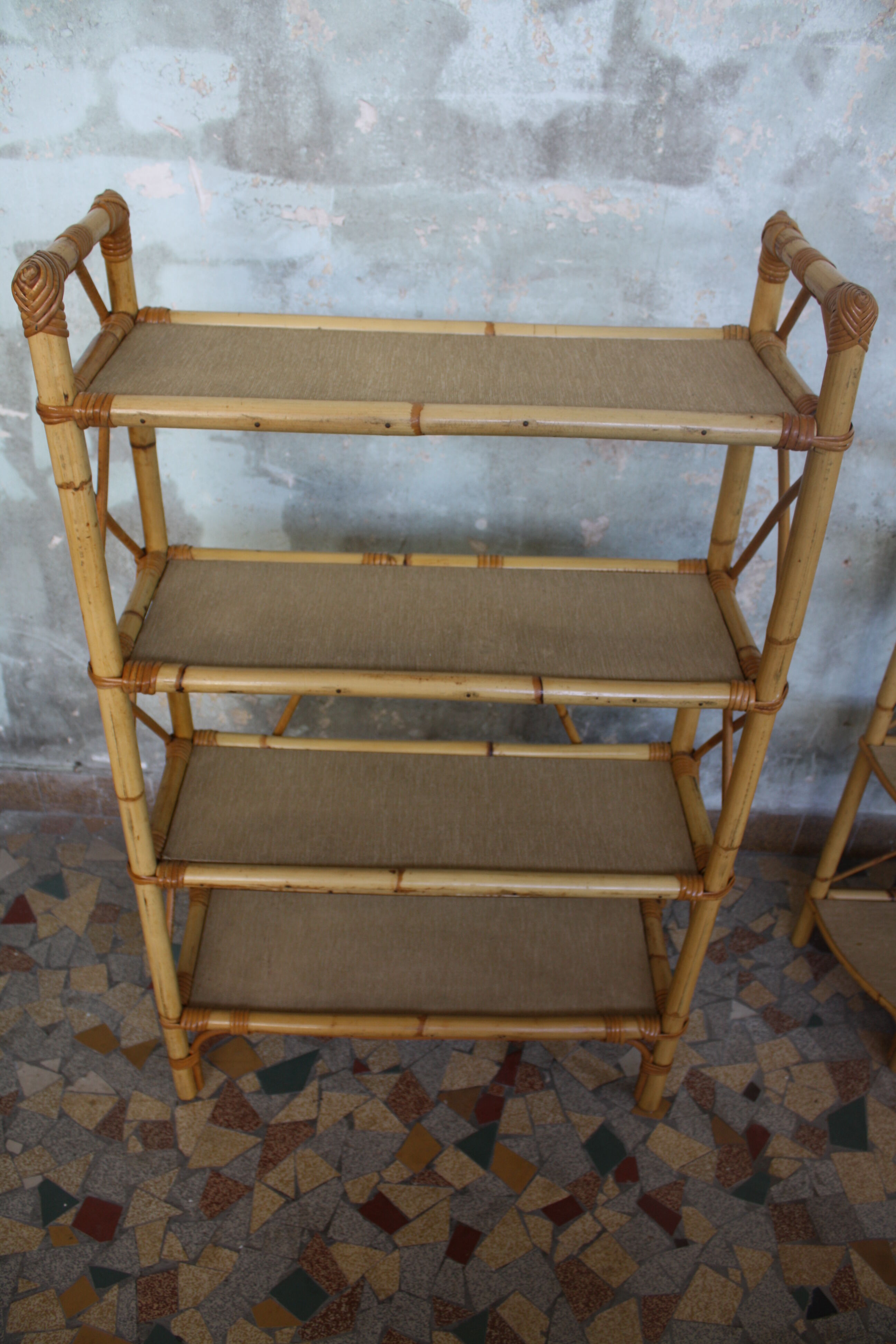 Pair of rattan shelves including a corner shelf